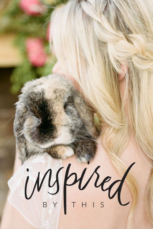 A woman with blonde hair braided to the side holds a brown and white bunny on her shoulder. The image has the text "inspired by this" overlaid on it.