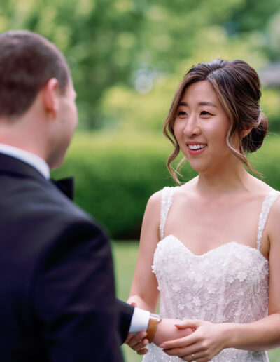 At a stunning Park Winters wedding, the bride and groom exchanged vows outdoors, surrounded by lush greenery.