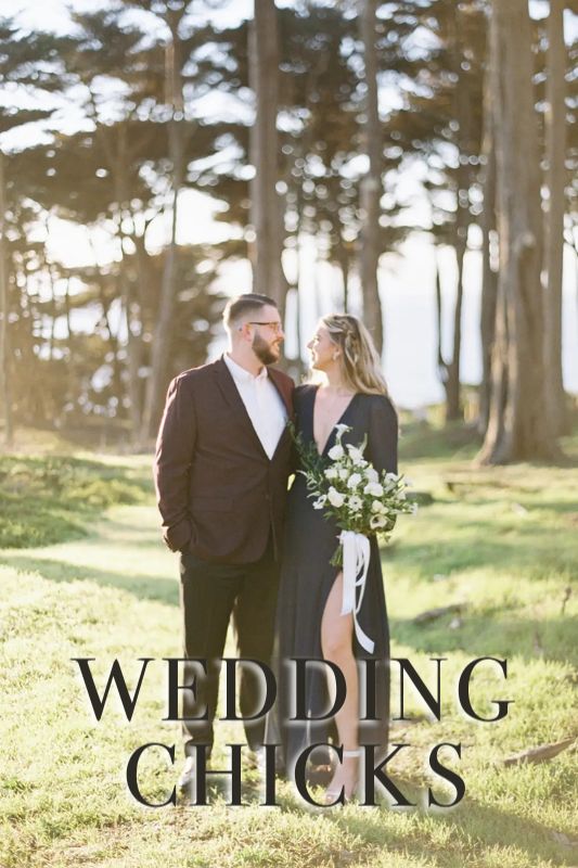 A couple stands outdoors in formal attire surrounded by tall trees, with "WEDDING CHICKS" written across the bottom of the image.